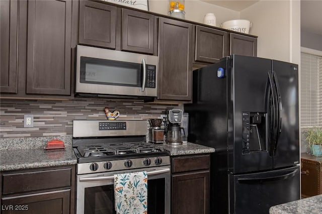 kitchen featuring light stone counters, stainless steel appliances, dark brown cabinetry, and decorative backsplash