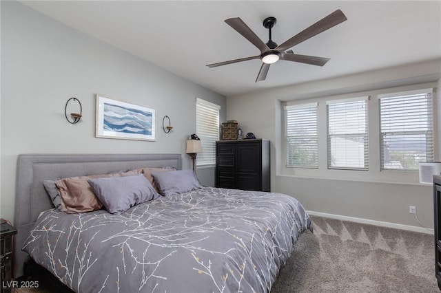 bedroom featuring a ceiling fan, carpet, and baseboards