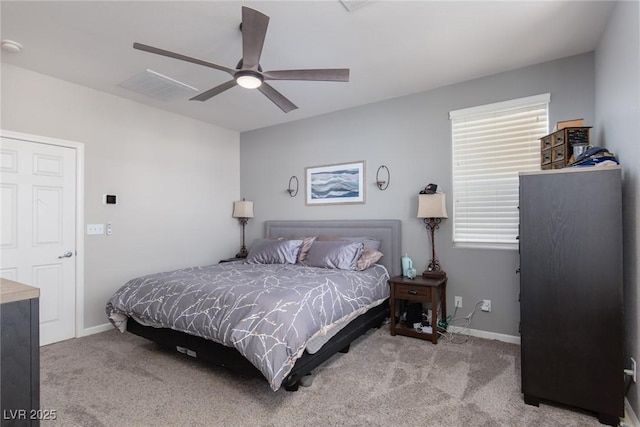 carpeted bedroom with multiple windows, baseboards, and visible vents