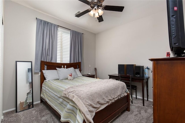 carpeted bedroom featuring baseboards and ceiling fan