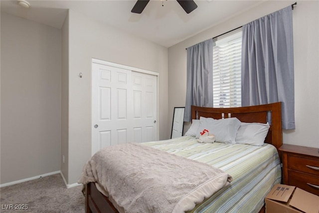 bedroom with a closet, carpet flooring, a ceiling fan, and baseboards