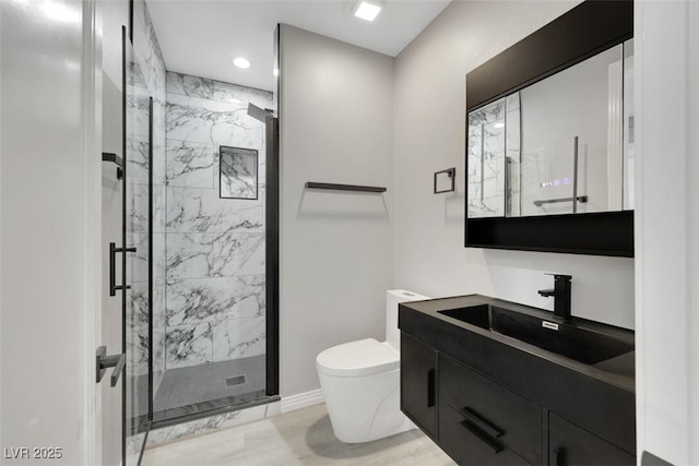 full bath featuring toilet, marble finish floor, recessed lighting, a marble finish shower, and vanity