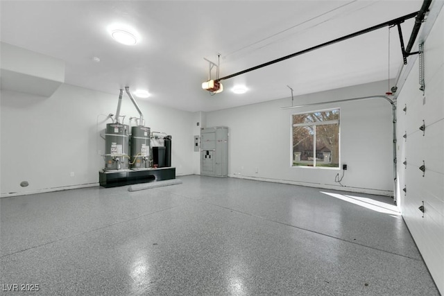 garage featuring secured water heater and a garage door opener