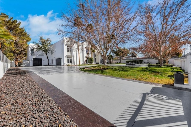 view of street with concrete driveway