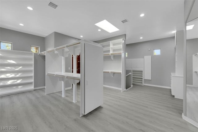 spacious closet with wood finished floors and visible vents