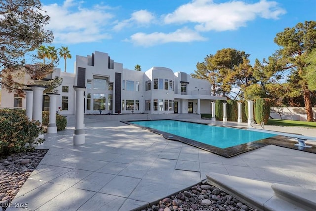 outdoor pool with a patio