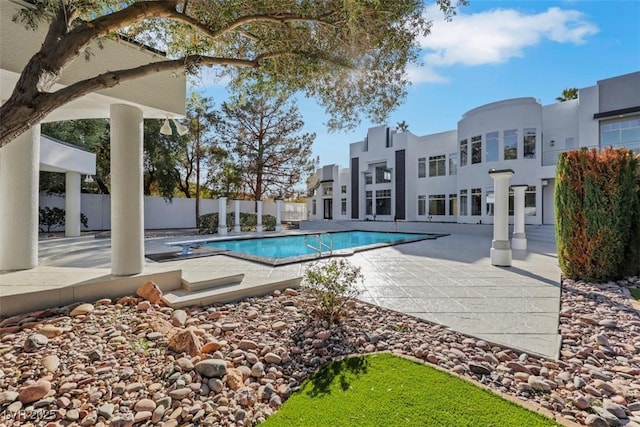 view of pool featuring a fenced in pool, a patio, and fence