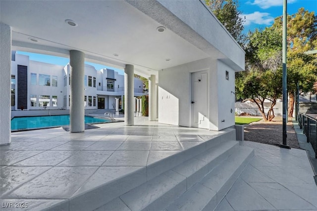 pool with a patio