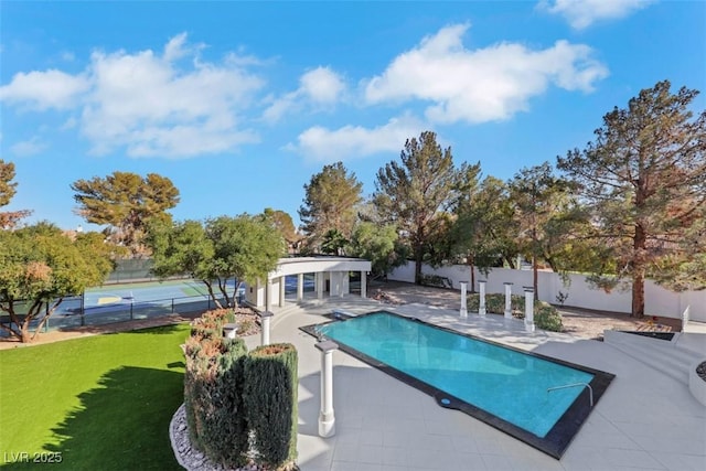 view of pool with a patio area, fence, and a fenced in pool