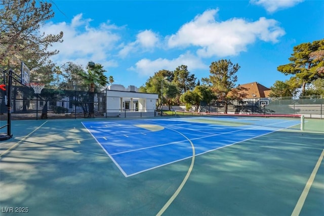 view of basketball court featuring community basketball court, fence, and a tennis court