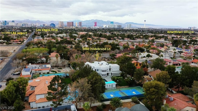 birds eye view of property featuring a view of city and a mountain view