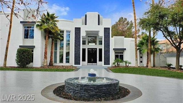 view of property with curved driveway