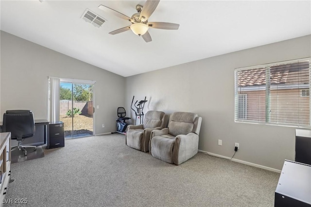 sitting room featuring a ceiling fan, carpet, visible vents, baseboards, and vaulted ceiling