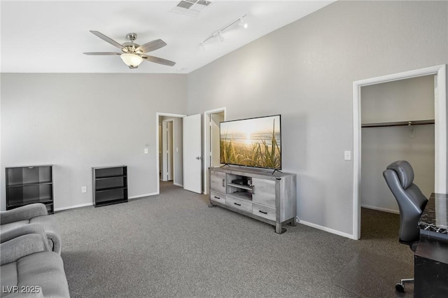 office with visible vents, baseboards, lofted ceiling, carpet floors, and a ceiling fan