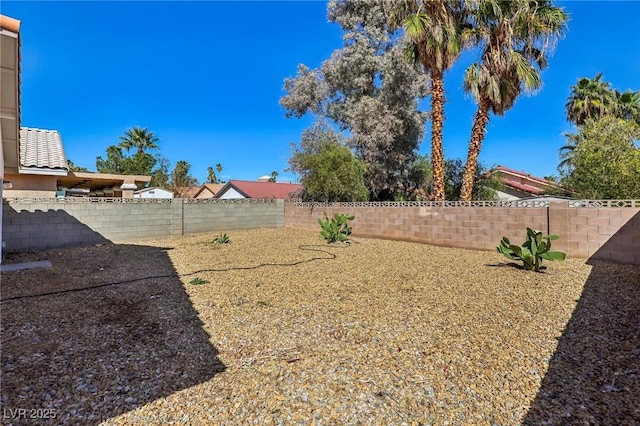 view of yard with a fenced backyard