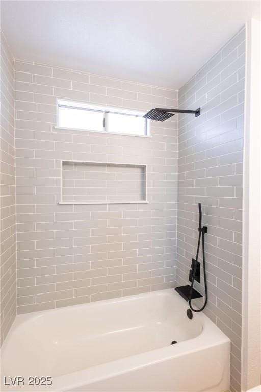 bathroom with shower / bath combination and plenty of natural light