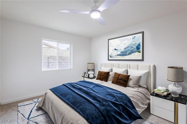 carpeted bedroom with baseboards and a ceiling fan