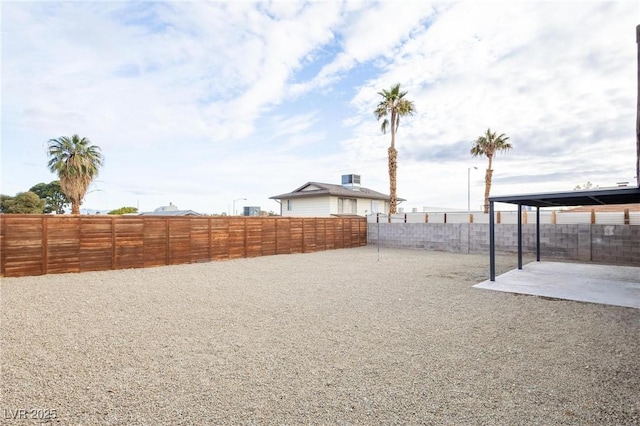 view of yard with a patio area and a fenced backyard