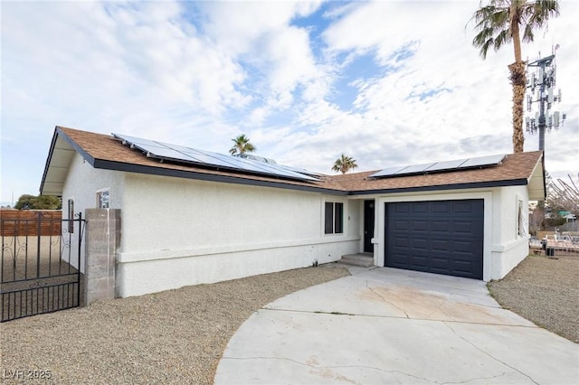 single story home with a gate, fence, driveway, stucco siding, and a garage