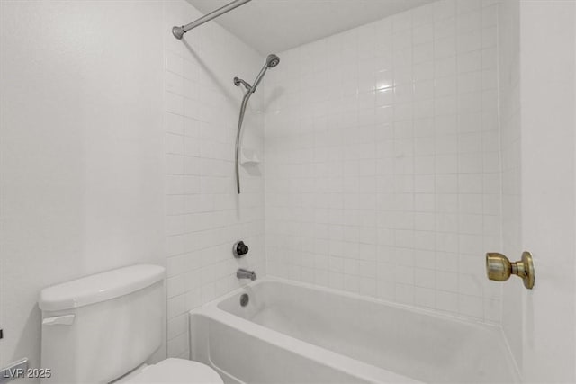 bathroom featuring toilet and bathing tub / shower combination