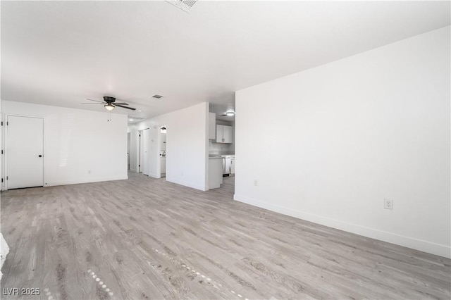 unfurnished living room featuring visible vents, baseboards, ceiling fan, and light wood finished floors