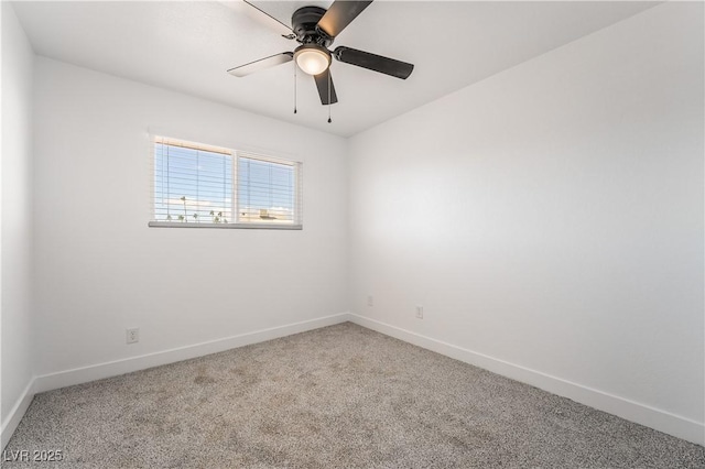 spare room with a ceiling fan, baseboards, and carpet floors