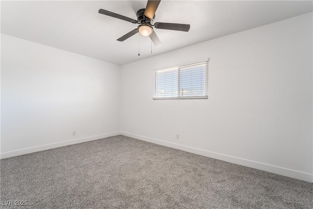 spare room with baseboards, carpet floors, and a ceiling fan