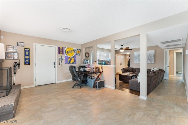 home office with visible vents and baseboards