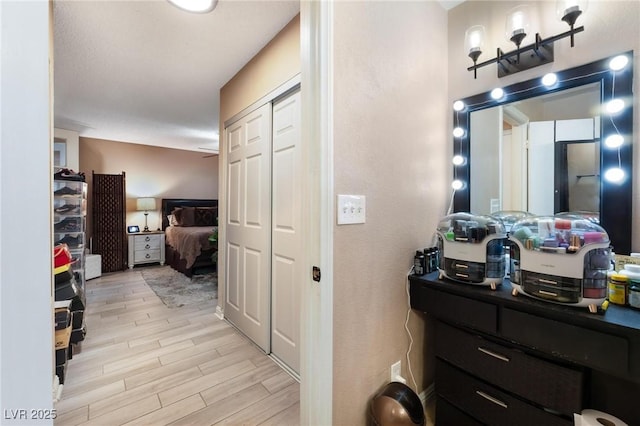 bathroom featuring ensuite bathroom and wood finish floors