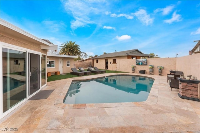 view of swimming pool with a patio area, a fenced in pool, and a fenced backyard