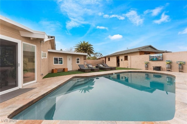 view of swimming pool featuring a patio, a fenced in pool, and fence private yard