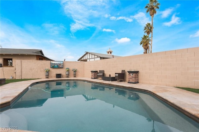 view of swimming pool with a fenced in pool and a fenced backyard