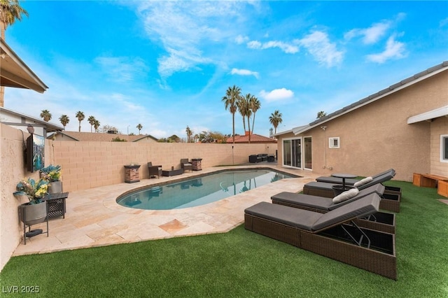 view of swimming pool with a patio area, a yard, a fenced backyard, and a fenced in pool