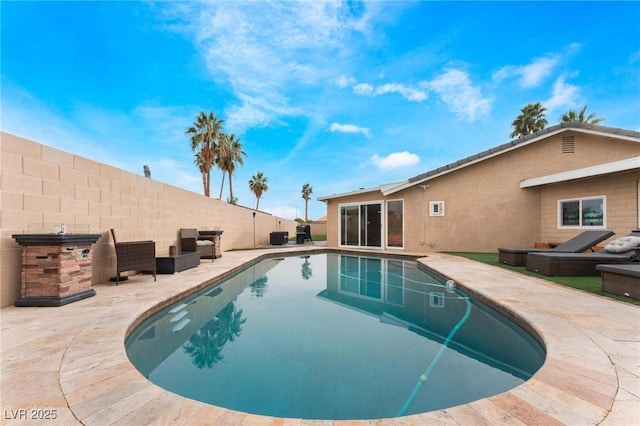 view of swimming pool featuring a fenced in pool, a patio, and fence