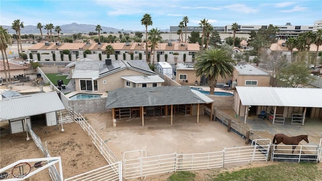 birds eye view of property with a mountain view and a residential view