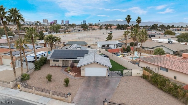 birds eye view of property featuring a city view and a mountain view