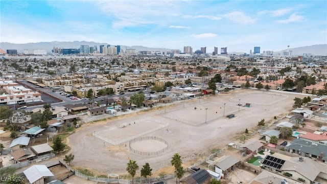 drone / aerial view featuring a city view and a mountain view