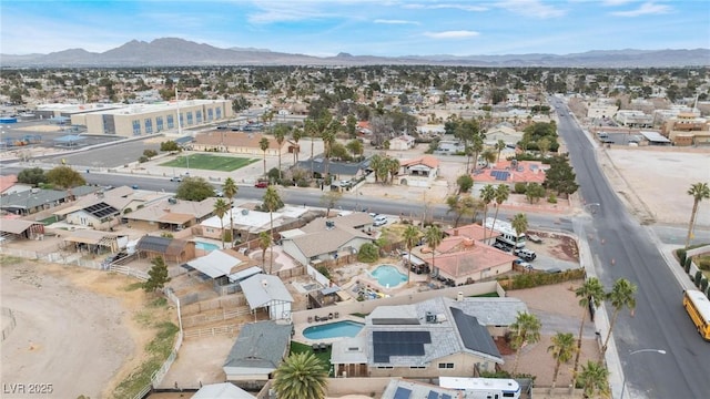 birds eye view of property with a mountain view and a residential view