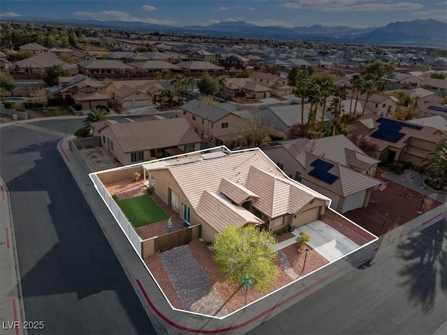 drone / aerial view with a mountain view and a residential view