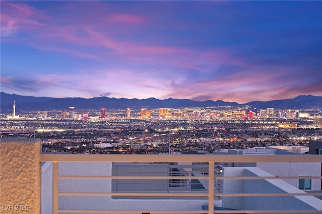 property's view of city featuring a mountain view