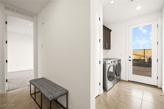 clothes washing area with visible vents, independent washer and dryer, recessed lighting, cabinet space, and light tile patterned floors