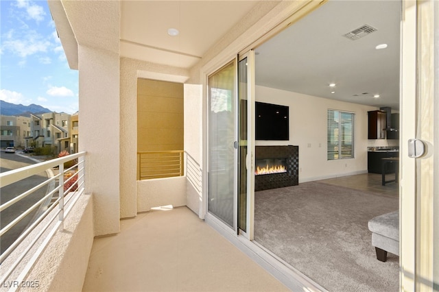 balcony with visible vents and a residential view