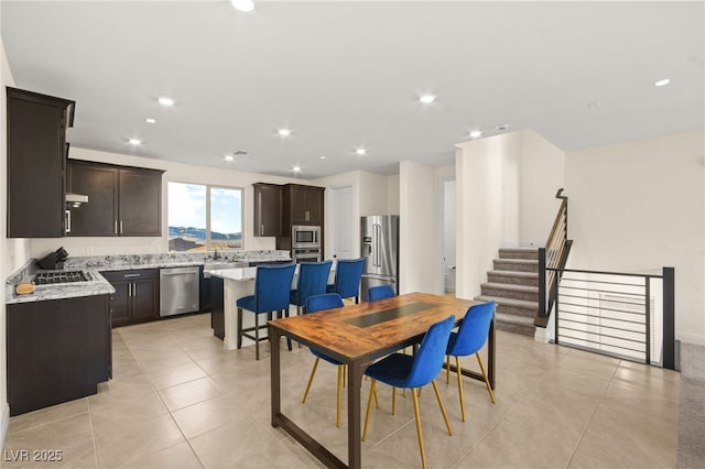 dining space featuring light tile patterned flooring, stairway, and recessed lighting