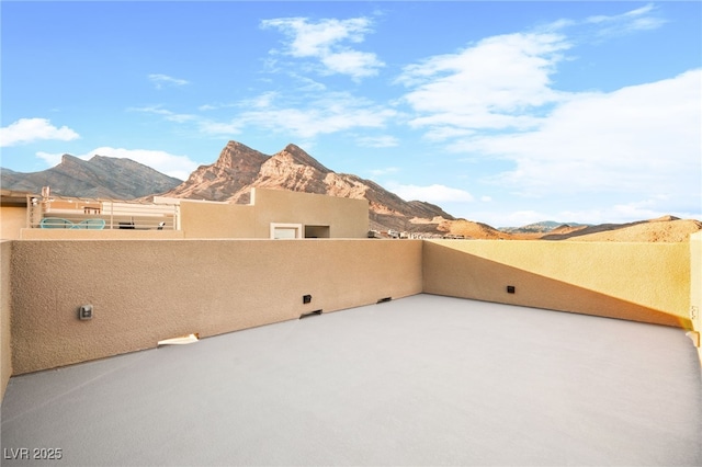 view of patio / terrace featuring a balcony and a mountain view