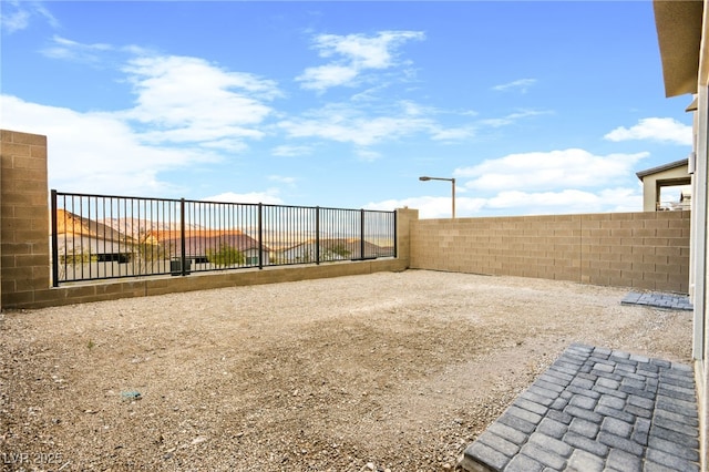 view of yard with a fenced backyard