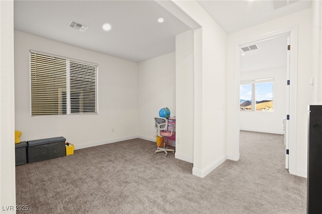 carpeted empty room featuring visible vents, recessed lighting, and baseboards