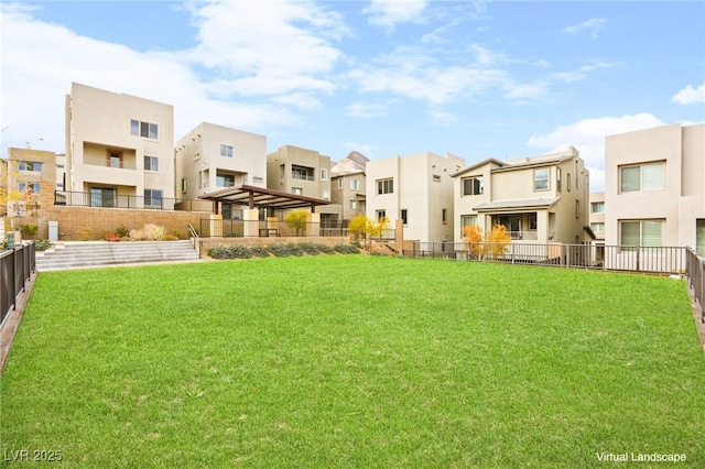 surrounding community featuring fence, a residential view, and a lawn