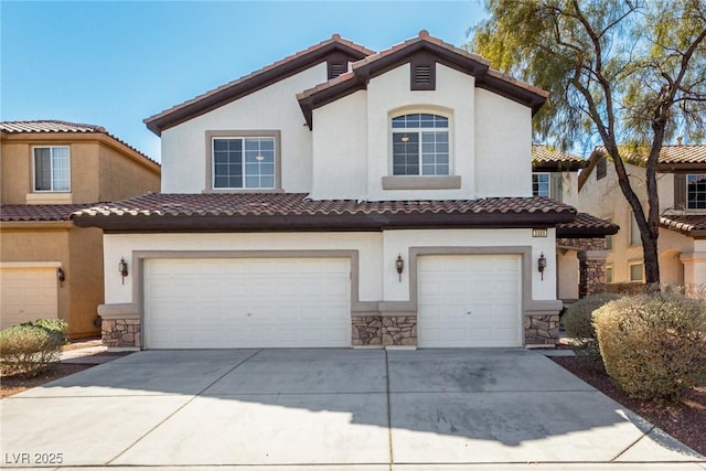 mediterranean / spanish-style house with a garage, stone siding, concrete driveway, and stucco siding