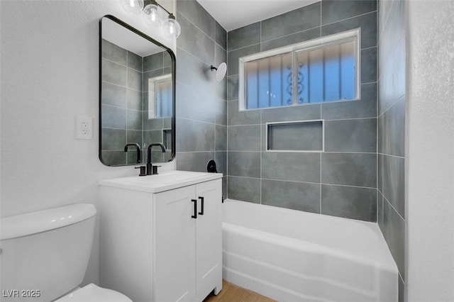 full bathroom with toilet, vanity, and shower / bathing tub combination