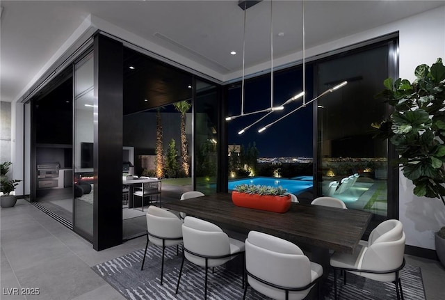 interior space featuring an outdoor pool and outdoor dining space